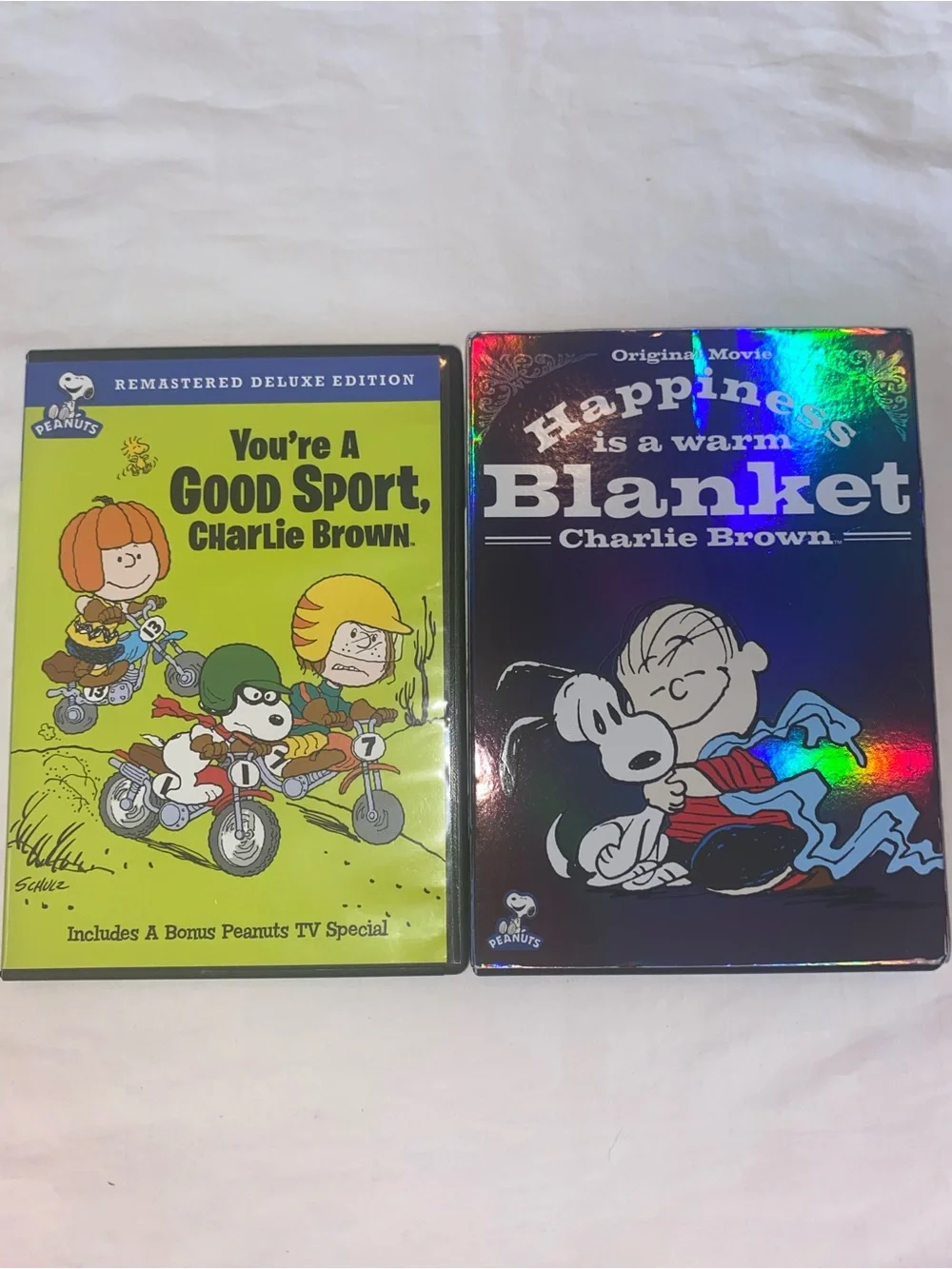 2 Snoopy/Peanuts DVD’s